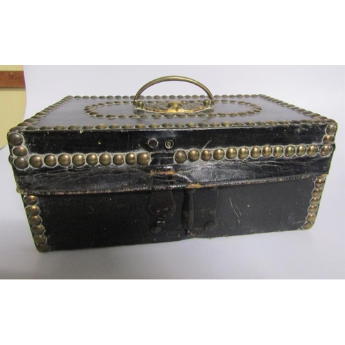 78 - A George III leather and brass studded small trunk, paper lined and with a label Charles M Domett.  ... 