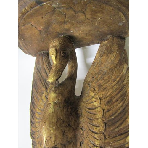 81 - A 19c carved wooden stucco gilded wall bracket supported by a swan with open wings.  37cms w x 47cms... 