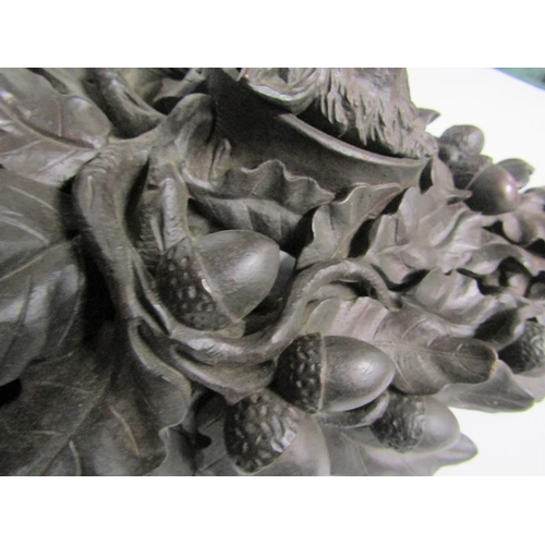 82 - A 19c Black Forest acorn and oak leaf carved wall bracket with a boars head mask.  28cm w x 39cm h.