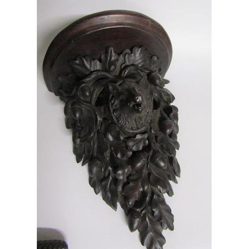 82 - A 19c Black Forest acorn and oak leaf carved wall bracket with a boars head mask.  28cm w x 39cm h.