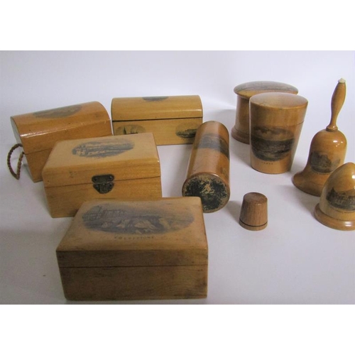 97 - A collection of seven mauchline ware boxes together with acorn thimble holder, a thimble and a powde... 