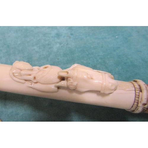 99 - A late 19c walking cane with white bone handle carved with a harnessed horses head and a gun dog wit... 