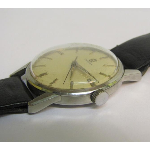 139 - A 1960 gents Omega wristwatch with mechanical movement.  The satin silver dial has bright silver bat... 