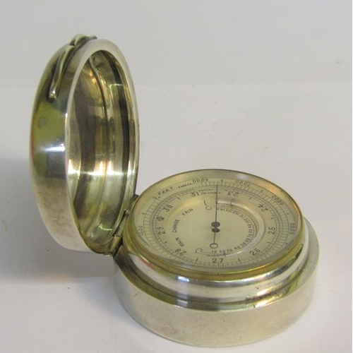 28 - A late 19c pocket aneroid barometer and thermometer.  The 4.5cms dia silvered dial indicates inches ... 