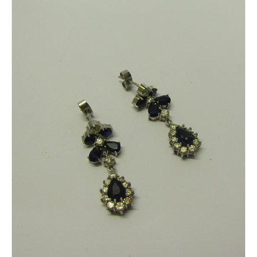 192 - A pair of Diamond and Sapphire set drop earrings