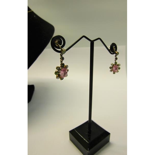 194 - An 18ct gold Pink Sapphire and Seed Pearl pendant necklace together with earrings.