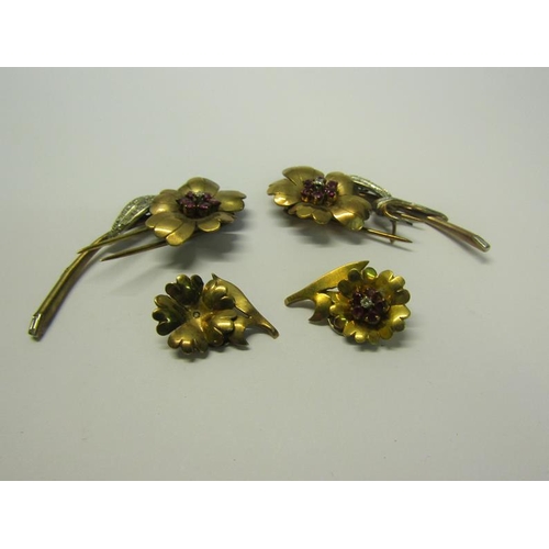 198 - A suite of gold Diamond and Ruby set jewellery comprising a matching pair of two petal and leaf form... 