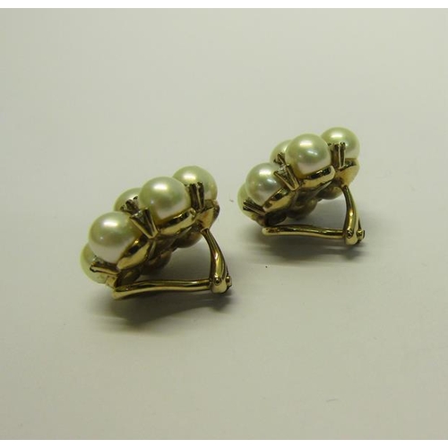 205 - A pair of gold Pearl and Diamond set earrings