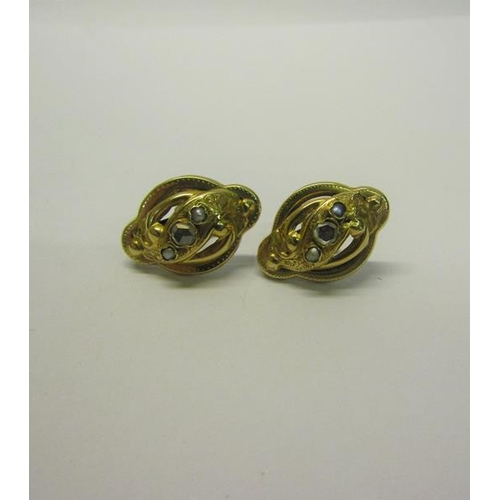 206 - A pair of gold Diamond set earrings