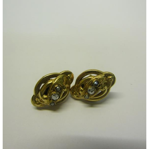 206 - A pair of gold Diamond set earrings