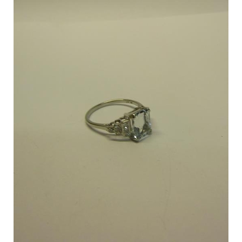 209 - A platinum art deco style ring set with Aquamarine and Diamonds. ring size O.