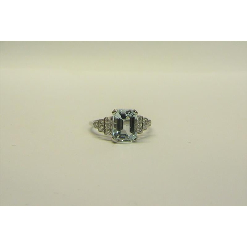 209 - A platinum art deco style ring set with Aquamarine and Diamonds. ring size O.