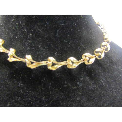 215 - A 9ct gold necklace of linked form - 36cms l. 13.g.