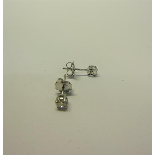 216 - An 18ct gold diamond stud earrings, approx 1/2 carat total.