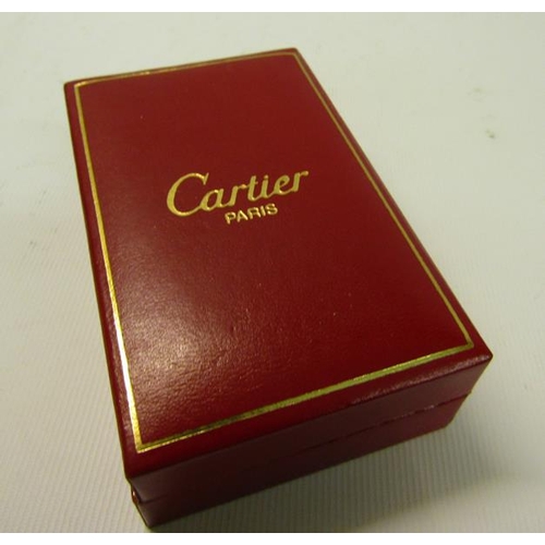 120 - A Cartier of Paris Plaque lighter or G28407V with black enamel and gilt case.  In original box.