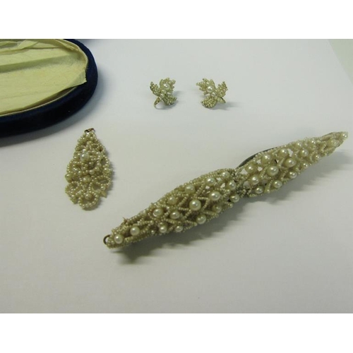 160 - A suite of Victorian seed pearl, comprising bar brooch, pair of earrings and a pendant.