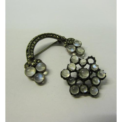 164 - An early 20c marcasite and moonstone set crescent brooch together with a pendant brooch of circular ... 