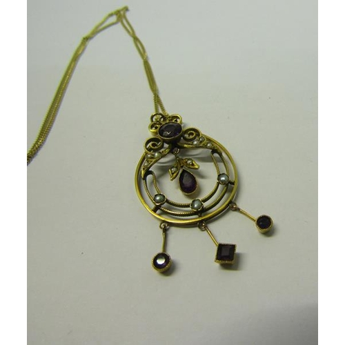 165 - A gold Amethyst and Seed Pearl set pendant, together with an 18ct gold chain.  The pendant with make... 