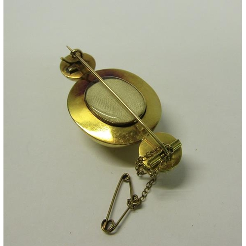 171 - An Edwardian gilt metal memoriam brooch.  5cms l.