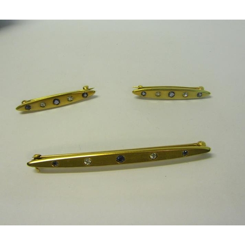 172 - Three gold Sapphire and Diamond set bar brooches, the principle brooch 6.3cms, the other two 3cms ea... 