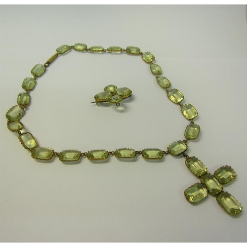 182 - A gilt metal yellow Beryl set necklace with pendant cross, together with a brooch.  Necklace 36cms l... 