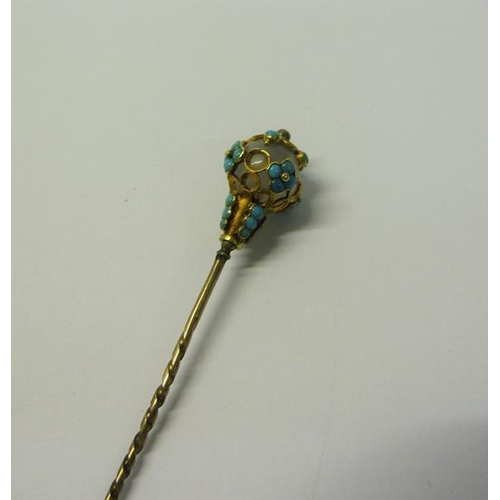 184 - A gold orb stick pin with Turquoise bead decoration.  8cms l.