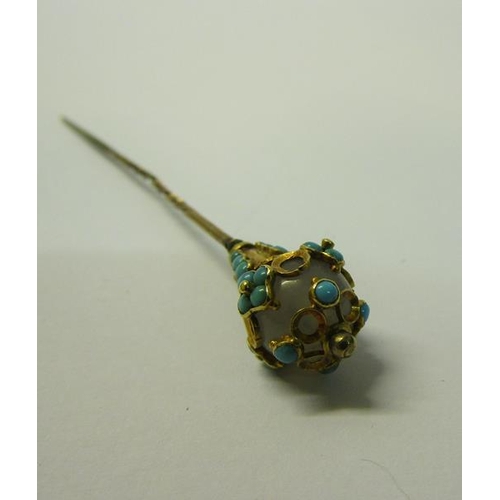 184 - A gold orb stick pin with Turquoise bead decoration.  8cms l.