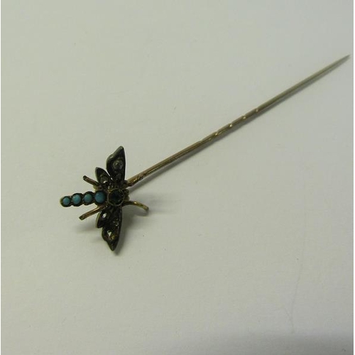 187 - A gold insect stick pin set with Turquoise and Diamond in the form of a Dragonfly.  6cms l.