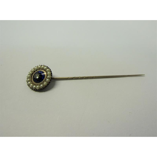 188 - A gold stick pin set with enamel Seed Pearl and Diamond.  6.6cms l.