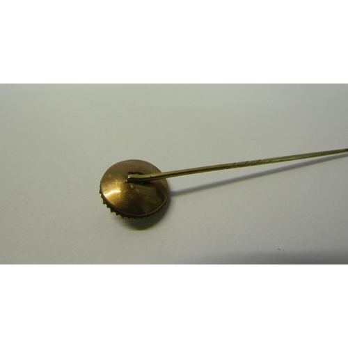 188 - A gold stick pin set with enamel Seed Pearl and Diamond.  6.6cms l.