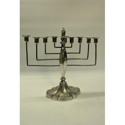 273 - A silver nine branch Menorah, makers mark Britton, Gould & Co, Birmingham 1932.  21cms w x 20cms h.