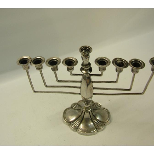 273 - A silver nine branch Menorah, makers mark Britton, Gould & Co, Birmingham 1932.  21cms w x 20cms h.