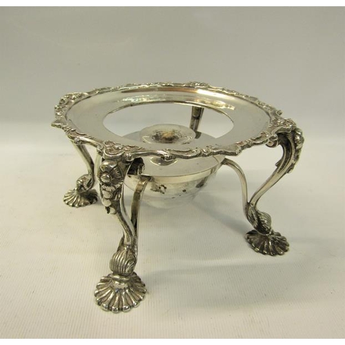 281 - A late Victorian silver plate warmer of circular form supported on four legs with burner, having a g... 