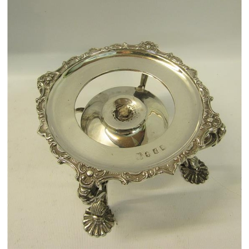 281 - A late Victorian silver plate warmer of circular form supported on four legs with burner, having a g... 