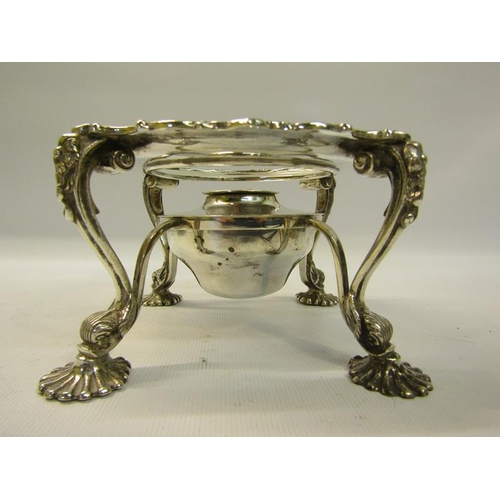 281 - A late Victorian silver plate warmer of circular form supported on four legs with burner, having a g... 