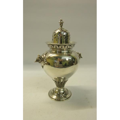 283 - A mid Victorian silver sugar caster of baluster form with fox head side mounts. Flared and engraved ... 