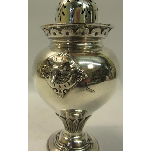 283 - A mid Victorian silver sugar caster of baluster form with fox head side mounts. Flared and engraved ... 