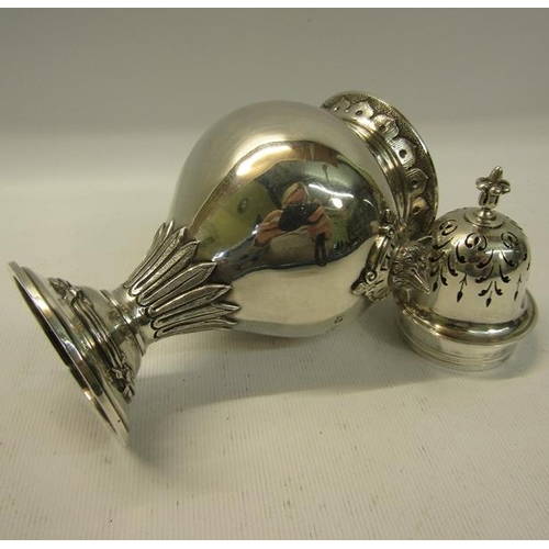 283 - A mid Victorian silver sugar caster of baluster form with fox head side mounts. Flared and engraved ... 