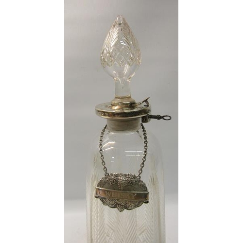 286 - A clear cut glass facet formed tapering decanter engraved with vertical leaf on a diamond cut base w... 