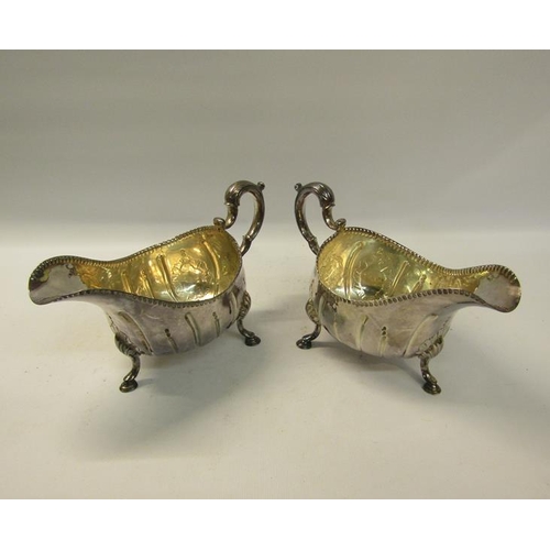 297 - A pair of late 18/early 19c Irish silver sauceboats with Dublin and Britannia mark, but no date lett... 