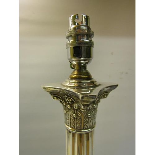 298 - An Edwardian silver Corinthian column table lamp with electrical fittings.  Makers mark for Goldsmit... 