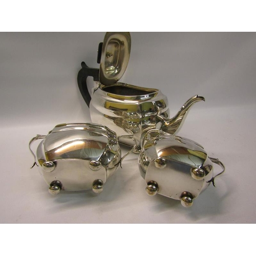 299 - A three piece silver tea service of squat baluster form comprising a teapot, sucrier and cream jug. ... 