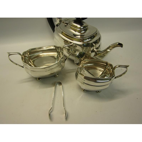 299 - A three piece silver tea service of squat baluster form comprising a teapot, sucrier and cream jug. ... 