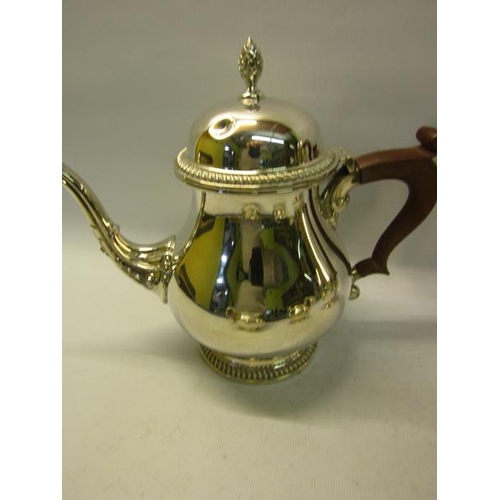 301 - A four piece silver tea and coffee service of baluster form, the teapot and coffee pot with hinged d... 