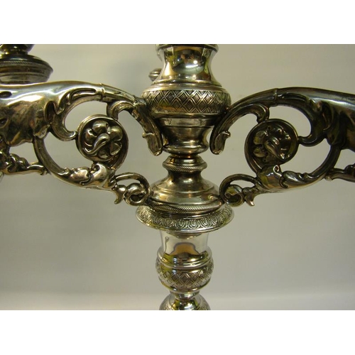 303 - A pair of 19c silver three branch candelabra's with knot fluted tapering columns and raised on stepp... 