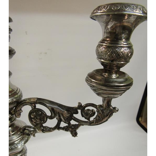 303 - A pair of 19c silver three branch candelabra's with knot fluted tapering columns and raised on stepp... 