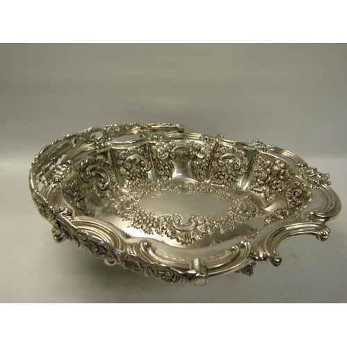 306 - A late Victorian silver basket with swing handle.  The basket with a shaped gadrooned formed rim wit... 