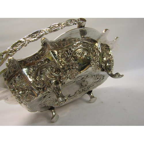 306 - A late Victorian silver basket with swing handle.  The basket with a shaped gadrooned formed rim wit... 