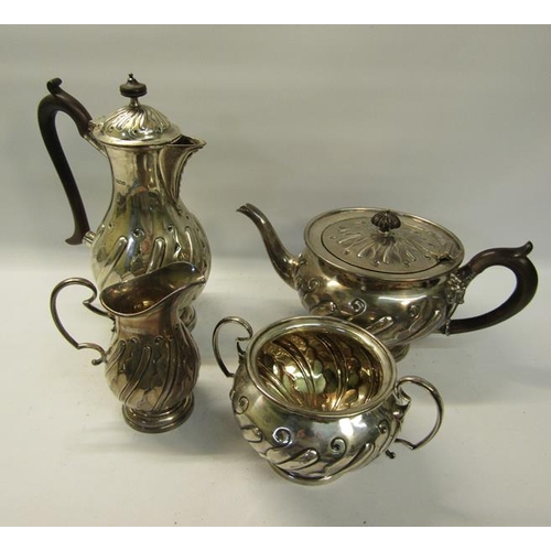 308 - A four piece silver tea and coffee service of baluster form.  The coffee and tea pot with hinged, sl... 