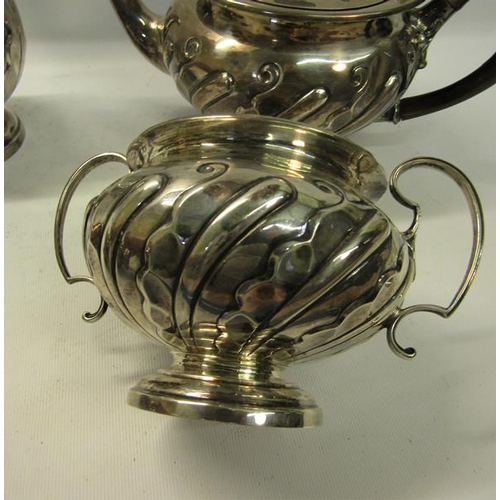 308 - A four piece silver tea and coffee service of baluster form.  The coffee and tea pot with hinged, sl... 